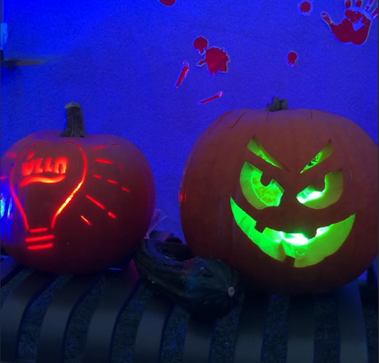 Two Halloween pumpkins with LED lights